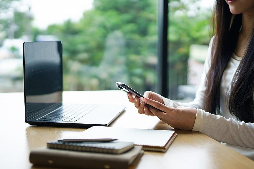 A young woman working remotely in a cafe